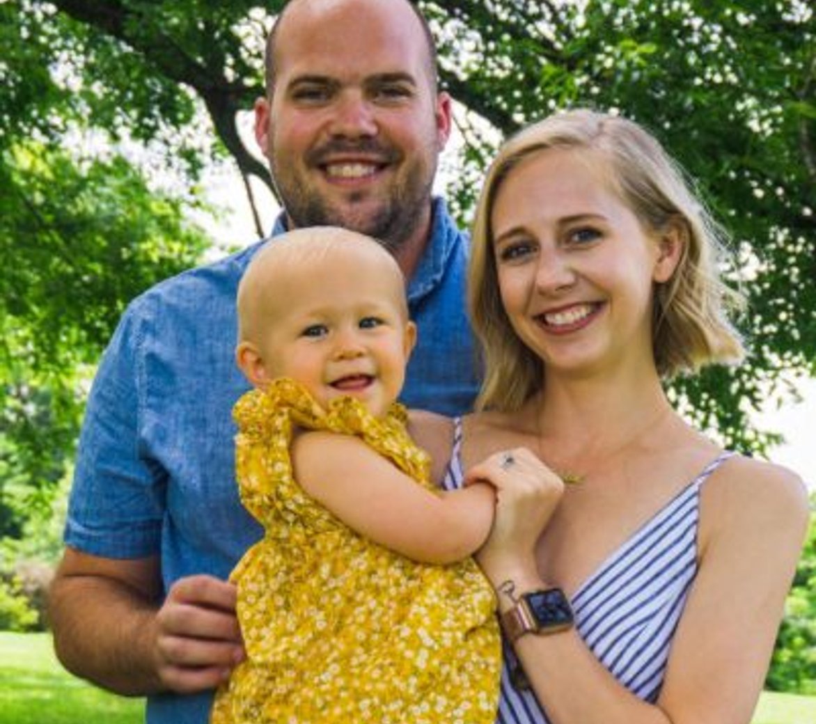 Mom and Father with adopted child