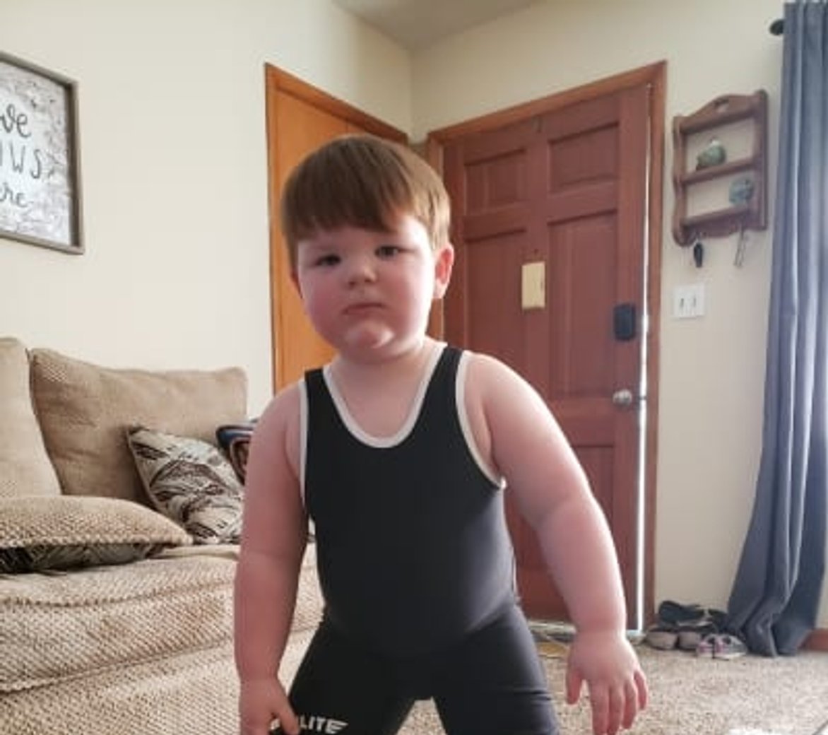 XXY child in wrestling suit