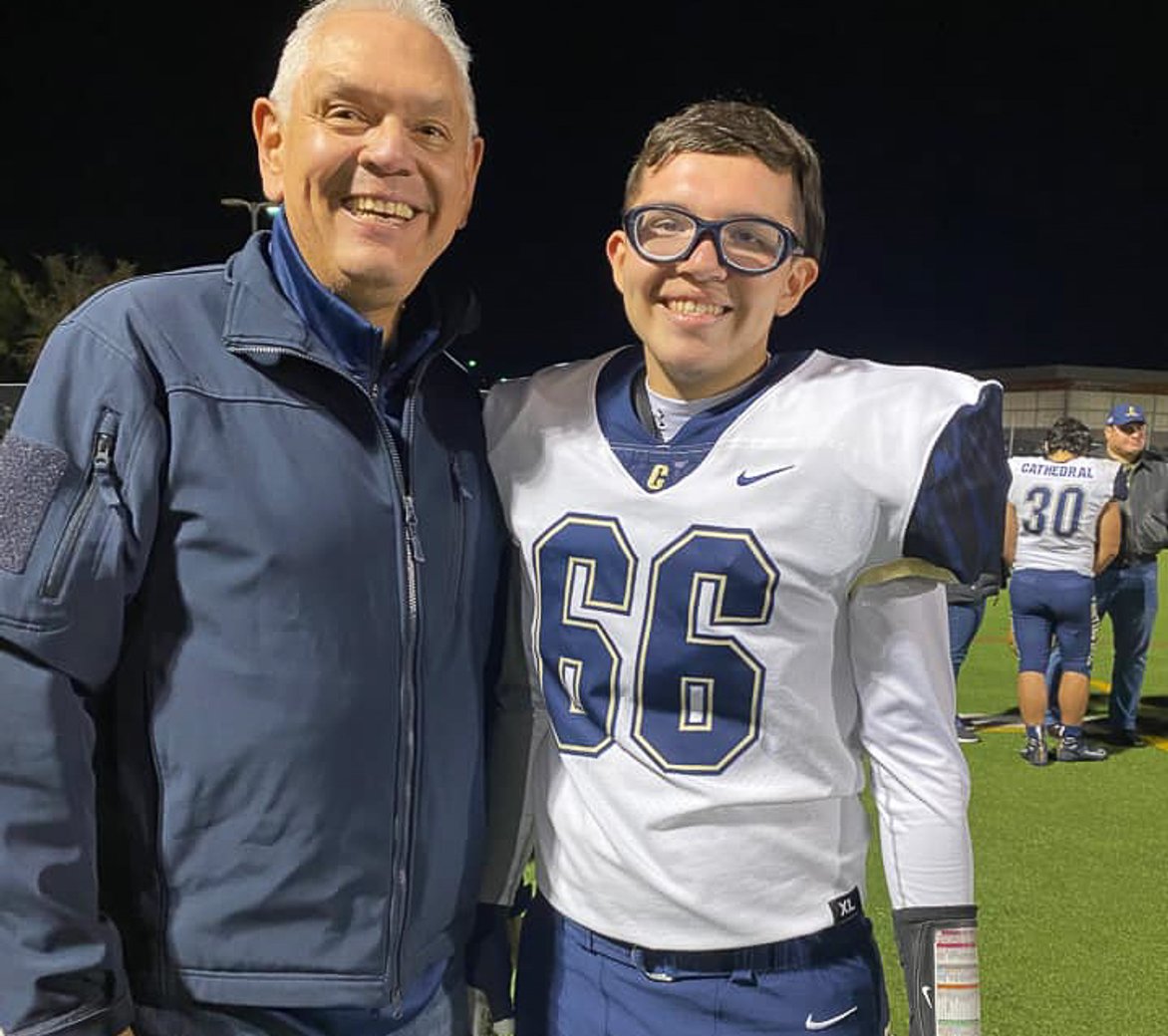 Father on football field with XXY
				son
