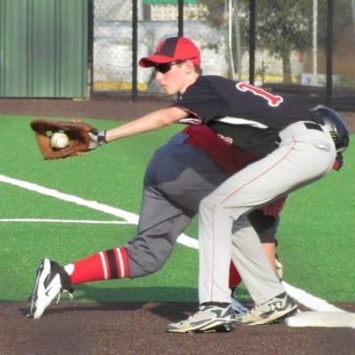 Playing first base in base ball